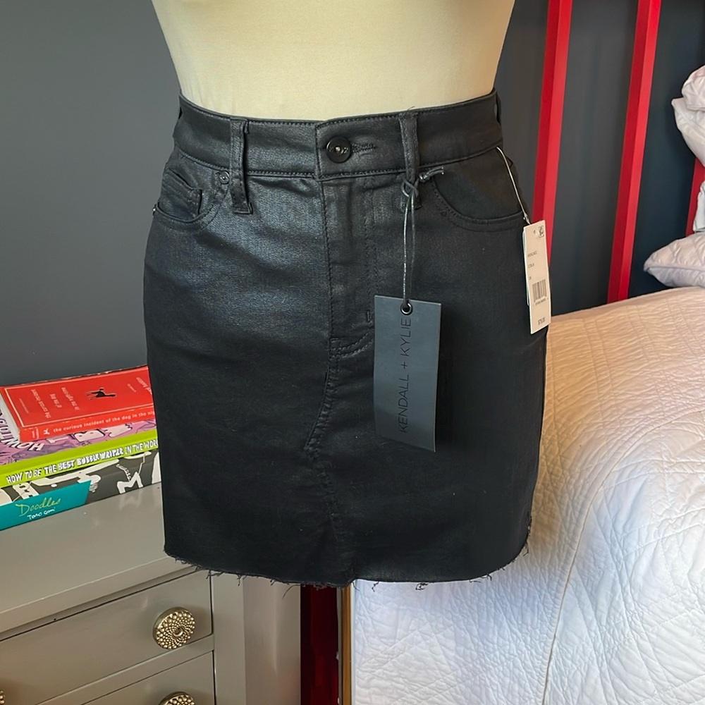 Black coated denim mini skirt